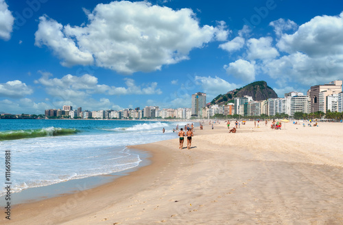 Copacabana beach in Rio de Janeiro, Brazil. Copacabana beach is the most famous beach in Rio de Janeiro. Men running on Copacabana beach photo