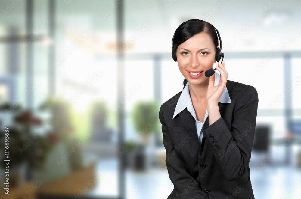 Happy young woman at work in call centre Happy young woman at work in call centre