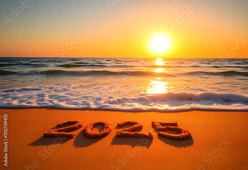 New year 2025 concept. Text 2025 written on sandy beach during sunset. New Year Start. Copy Space. photo