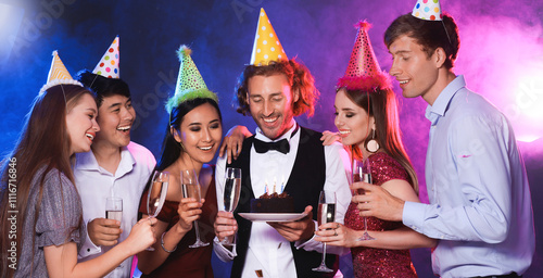 Group of friends celebratin...