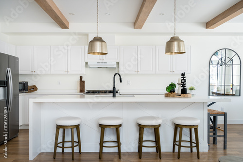 A white modern kitchen at a rental property.