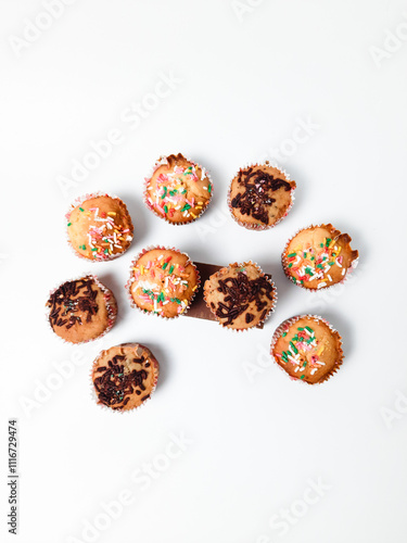 Banana muffin or banana cupcake with sprinkles with an isolated white background. Top view