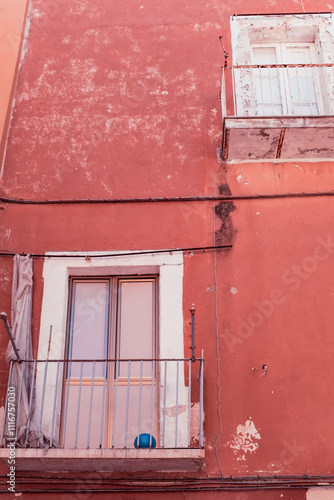 Old and rusty ruined building facade in an old town village in Bari, Italy touristic center