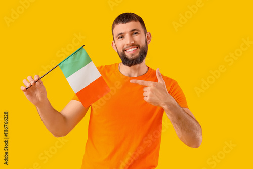 Handsome man pointing at fl...