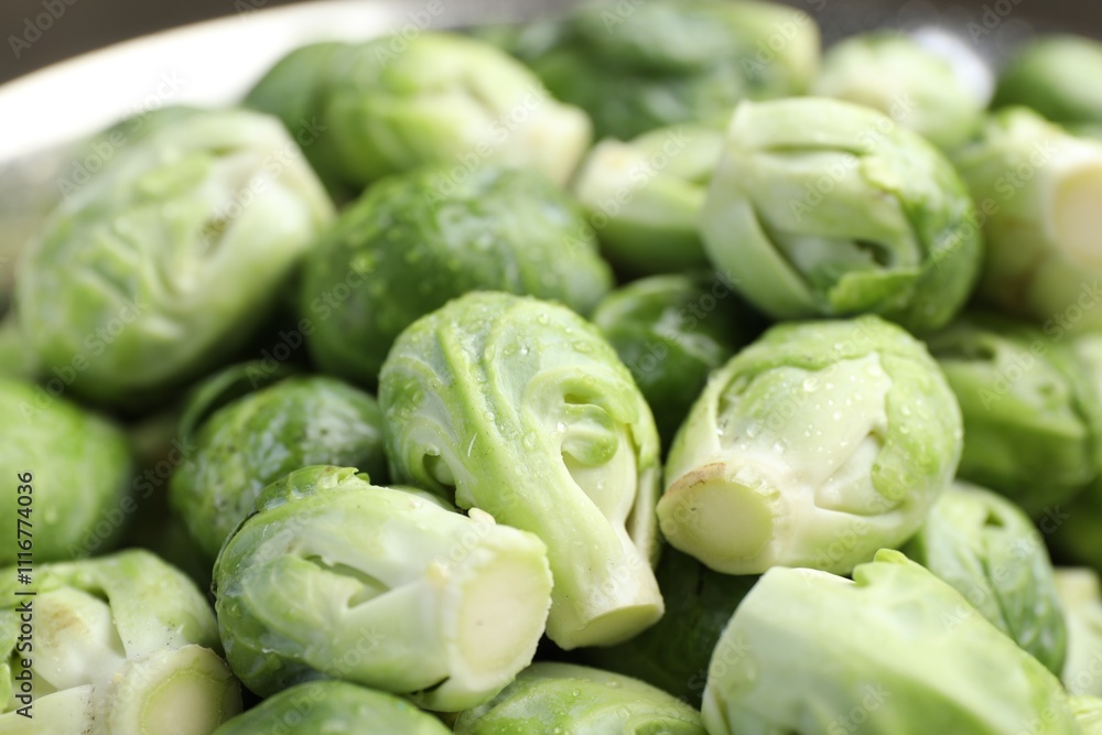 Fresh Brussels sprouts in metal colander, closeup Fresh Brussels sprouts in metal colander, closeup