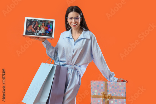 Happy young woman with lapt...