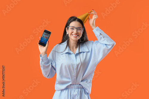 Happy young woman with mobi...
