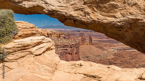 Glimpse of canyons in the Island in the Sky district of Canyonlands National Park seen through the Mesa Arch