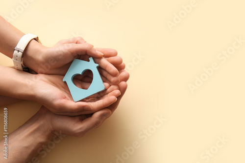 Couple holding house figure...