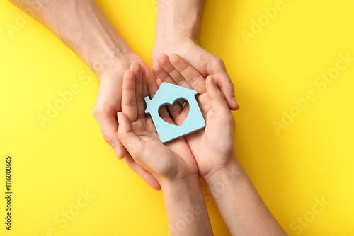 Couple holding house figure...