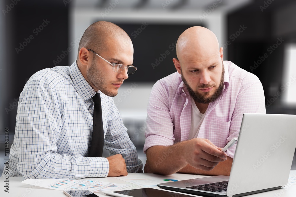 Obraz premium Two happy professional business people together in modern office