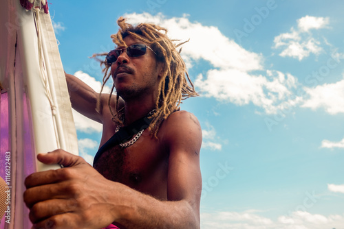 Portrait of a male with dreadlocks on a boat on Seychelles photo