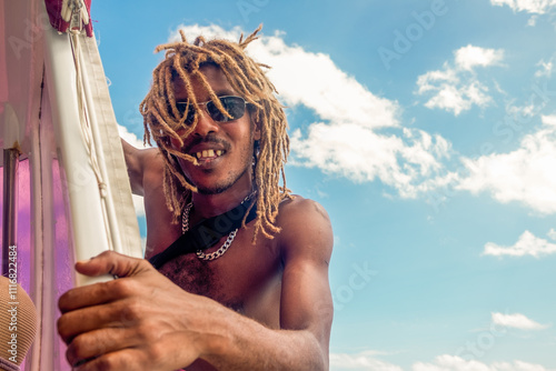 Portrait of a male with dreadlocks on a boat on Seychelles photo