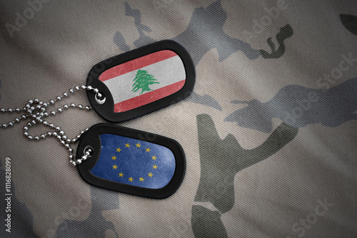 army blank, dog tag with national flag of lebanon and european union on the khaki texture background. military concept. photo