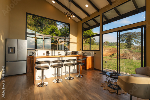 Interior of an equipped kitchen of a cabin with a view of landscapes photo