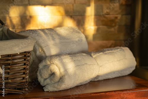 Towels placed near a bathroom in a cabin photo