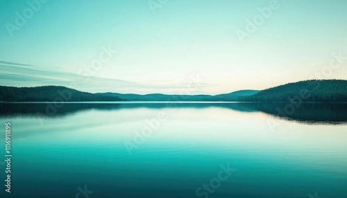 A serene lake reflecting the calmness of nature at twilight.