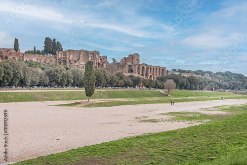 The Circus Maximus is an ancient Roman chariot racing stadium and mass entertainment venue located in the valley between the Aventine and Palatine hills, the first and largest stadium in ancient Rome. photo