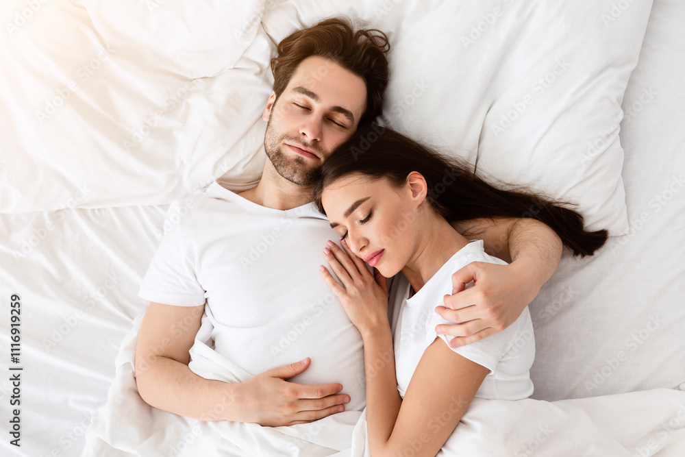 Married Couple Sleeping Together Embracing Lying In Comfortable Bed At Home At Night. Top View Shot Of Spouses Resting Peacefull Enjoying Nap In Comfortable Bedroom Married Couple Sleeping Together Embracing Lying In Comfortable Bed At Home At Night. Top View Shot Of Spouses Resting Peacefull Enjoying Nap In Comfortable Bedroom