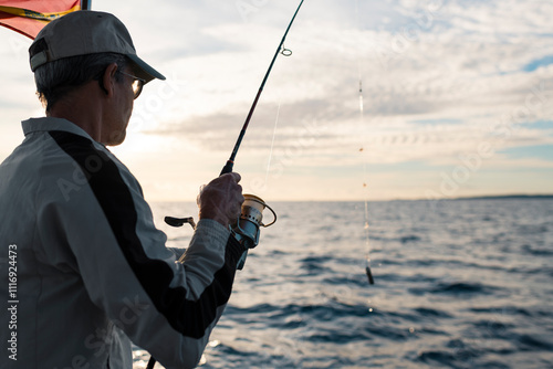 Wallpaper Mural Man fishing at the sea Torontodigital.ca
