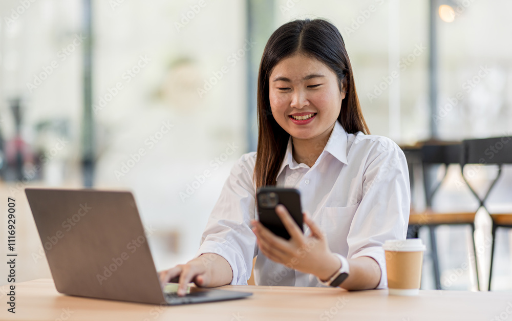 Portrait of a happy Asian business woman using mobile phone in the workplace office , Asian businesswoman working in modern office.
Portrait of a happy Asian business woman using mobile phone in the workplace office , Asian businesswoman working in modern office.