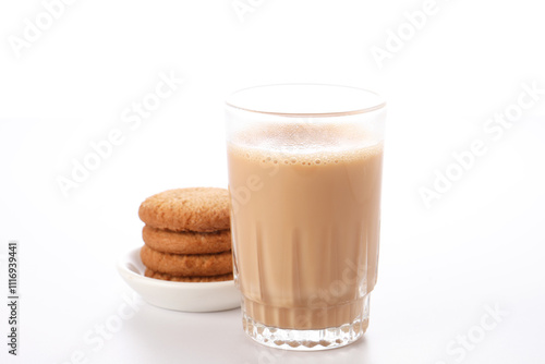 Hot masala tea masala chai and biscuit, Kerala India. Evening tea with refreshing Indian blend of black tea with milk and spices