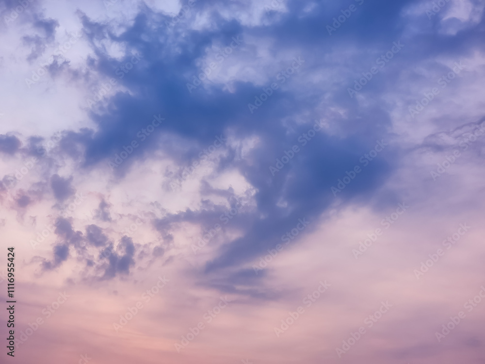 A dramatic, moody sky with swirling clouds in shades of purple and pink. Perfect for backgrounds or to evoke a sense of mystery and emotion A dramatic, moody sky with swirling clouds in shades of purple and pink. Perfect for backgrounds or to evoke a sense of mystery and emotion