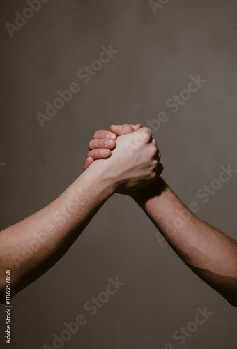 Hand Gesture. Concept of confrontation, competition. Giving respect or approval. Teamwork and friendship. Partnership concept. Man giving fist bump. Bumping fists together.