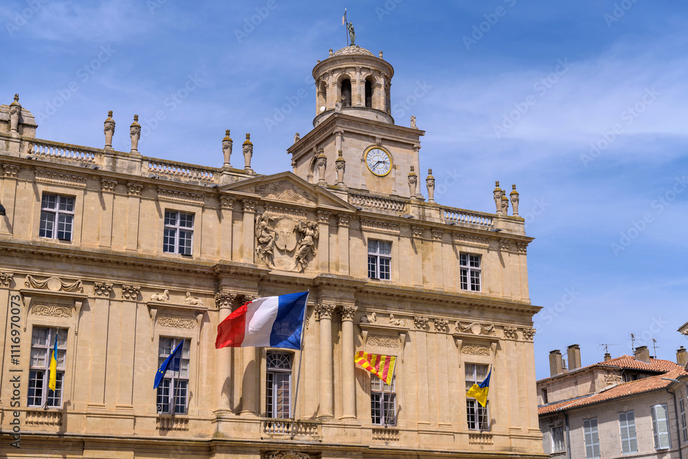 Town Hall of Arles - A close-up and low-angle view of the historic Town Hall of Arles at the main town square, place de la Republique, on a sunny Spring day. Arles, Southern France. Town Hall of Arles - A close-up and low-angle view of the historic Town Hall of Arles at the main town square, place de la Republique, on a sunny Spring day. Arles, Southern France.