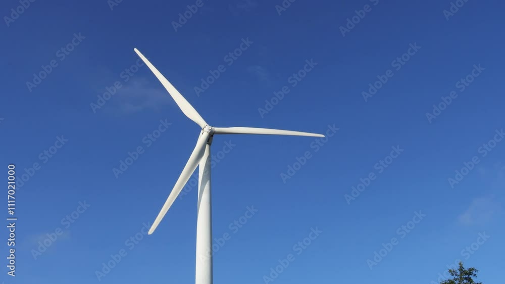 Windmill with cumulus clouds moves in the blue sky. Wind turbines operating for renewable electric energy at Lam Takhong, Nakhon Ratchasima Province, Thailand. Windmill with cumulus clouds moves in the blue sky. Wind turbines operating for renewable electric energy at Lam Takhong, Nakhon Ratchasima Province, Thailand.