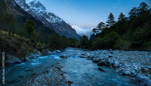 Mountain creek whispers through darkness, water dancing over ancient stones, moonlight painting silvery patterns on its restless surface. photo