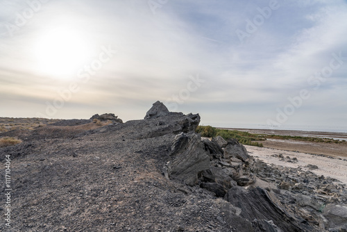 Obsidian Butte on the south shore of the Salton Sea. Calipatria, Imperial County, California. The Salton Buttes lie within the Salton Sea Geothermal Field. Rhyolite. dry lake bed. photo