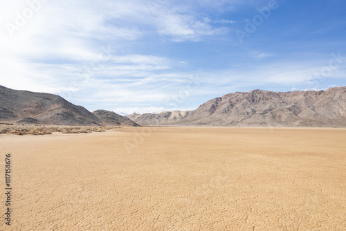 Moving rocks in the dry lake bed at The Racetrack at Death Valley National Park, California