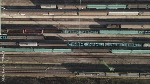 Aerial View of Freight and Passenger Trains at Railway Yard photo