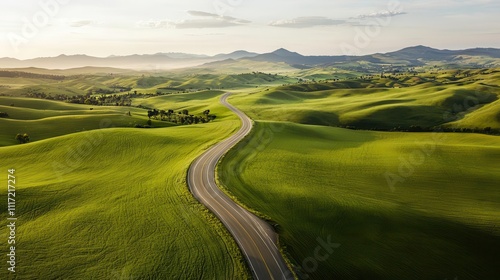 Aerial view of a highway intersection surrounded by rolling green hills and farmland, Highway intersection, Scenic, expansive, peaceful