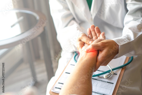 Doctor holds and examines a patient's wrist, focusing on providing accurate diagnosis and care.Professional medical attention, trust, and the importance of addressing wrist pain or injury.