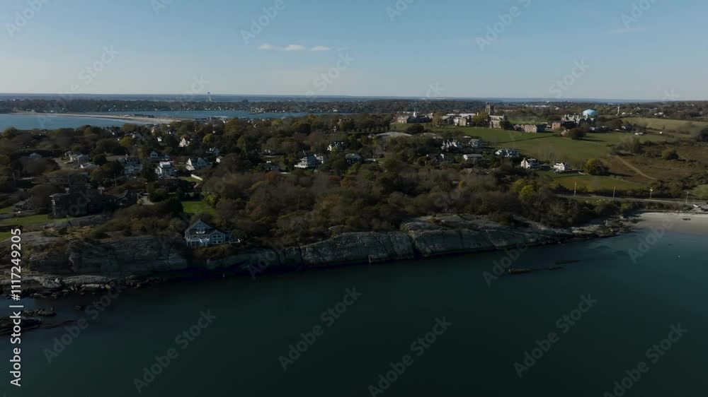 Aerial of New England beach town on rocky cliff in autumn on a sunny day in Newport Rhode Island outskirts Aerial of New England beach town on rocky cliff in autumn on a sunny day in Newport Rhode Island outskirts