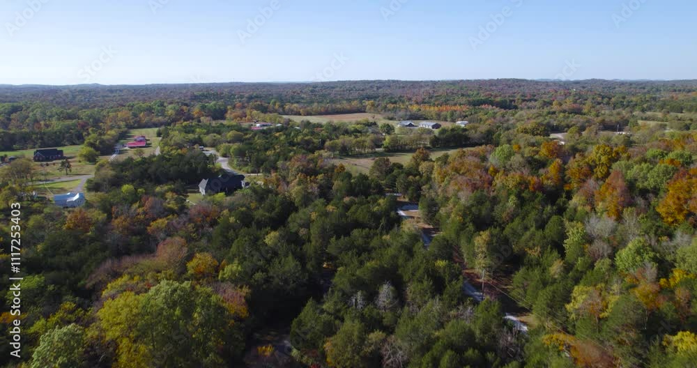Quiet Neighborhood With Forest During Fall Season On A Sunny Day In Tennessee. - aerial shot Quiet Neighborhood With Forest During Fall Season On A Sunny Day In Tennessee. - aerial shot