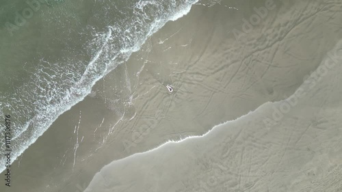 woman sitting on the sand
