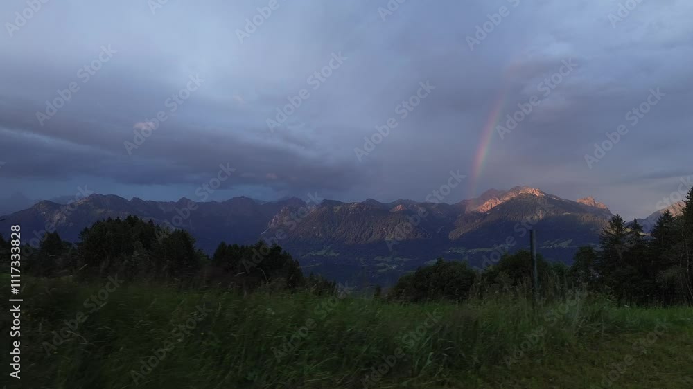 Drone fly above Forest reveal Mountain Range with Rainbow in Background Early Morning Drone fly above Forest reveal Mountain Range with Rainbow in Background Early Morning