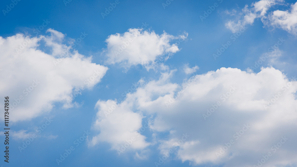 Fototapeta premium Blue and cloudy clear sky background. White fluffy cloud in nature cloudscape background.