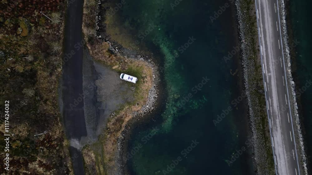 Aerial drone topdown view of van sitting by side of a road in Lofoten, Norway Aerial drone topdown view of van sitting by side of a road in Lofoten, Norway