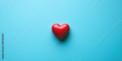 A red heart icon on a blue surface, symbolizing love or affection.