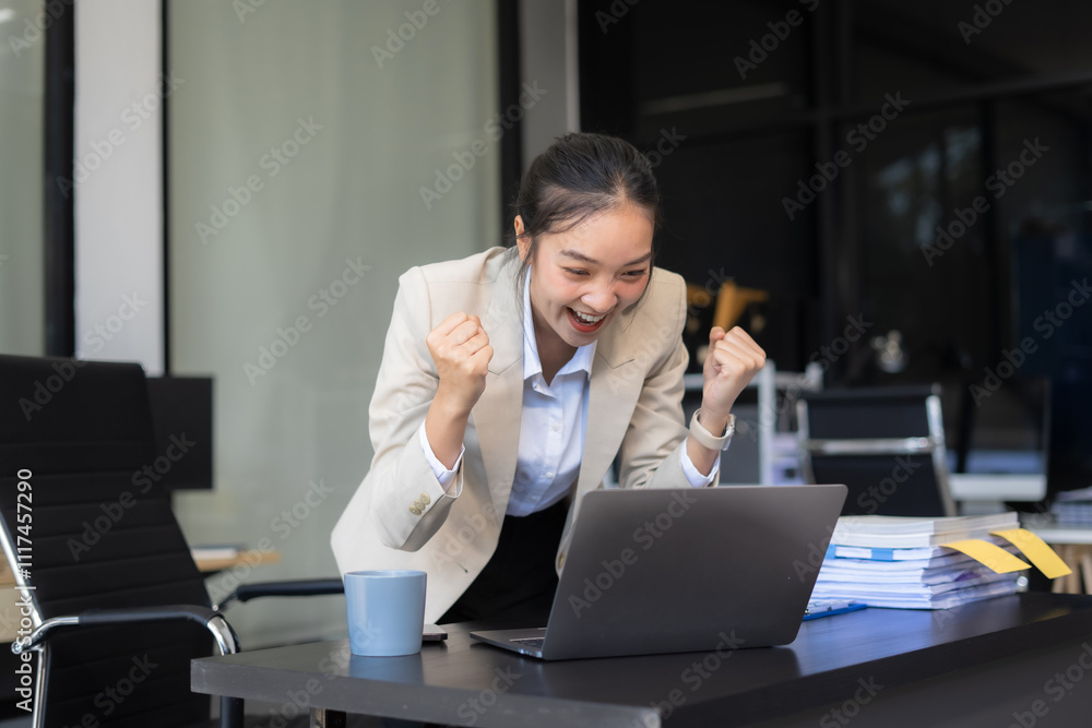 Asian business woman are excited business success with inspiration from their excellent financial results that are happy working in a modern office on a computer. Asian business woman are excited business success with inspiration from their excellent financial results that are happy working in a modern office on a computer.