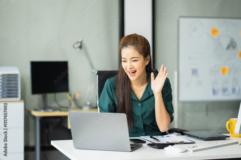 Happy businesswoman having fun doing video call using laptop during her free time. Happy businesswoman having fun doing video call using laptop during her free time.