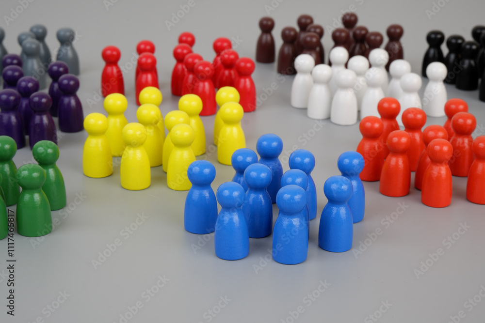 Colored people figures united into different groups on gray background. Social separation concept. Colored people figures united into different groups on gray background. Social separation concept.
