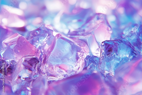 Close-up of colorful ice cubes reflecting light in shades of blue and purple.