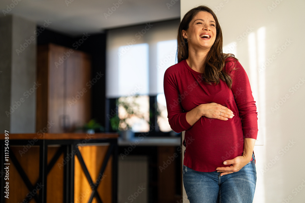 Fit pregnant woman holding hands on her belly, enjoying in the last trimester of pregnancy. Fit pregnant woman holding hands on her belly, enjoying in the last trimester of pregnancy.