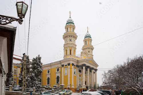 uzhhorod, ukraine - 12 jan, 2013: holy cross cathedral in winter. cloudy day, snowy weather. baroque church of 17s century photo