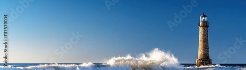 A stunning lighthouse stands tall against crashing waves under a clear blue sky, symbolizing guidance and maritime safety.